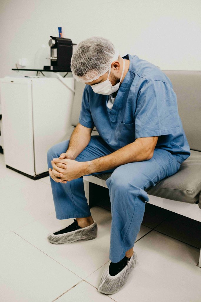 Nurse praying at work