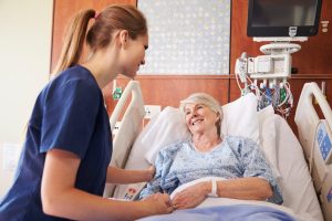 Geriartic nurse caring old patient